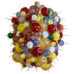 Used Late 20th Century Multicolored Pulegoso Murano Art Glass and Brass Chandelier