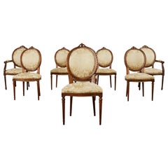 Set of Eight French Louis XVI Style Walnut Dining Chairs