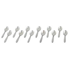 Vintage Georg Jensen, Kaktus, set of twelve sterling silver dessert spoons.