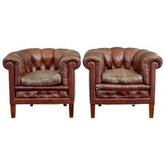 Antique Pair of early 20th Century leather lounge armchairs
