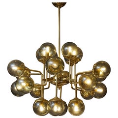 Brass chandelier by Studio Glustin