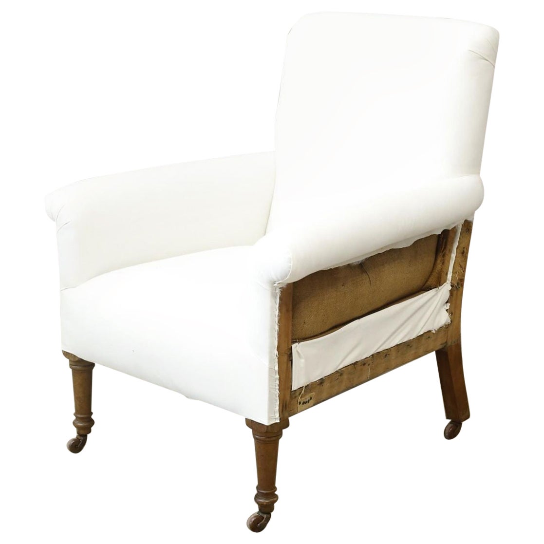 Large proportioned Edwardian armchair on tall legs