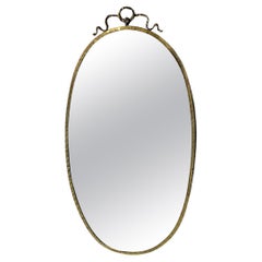 Italian mid-century modern brass wall mirror with bow, 1950s