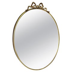 Retro Mid-Century Modern, Oval mirror 1950s, Italian manufacture, with brass frame