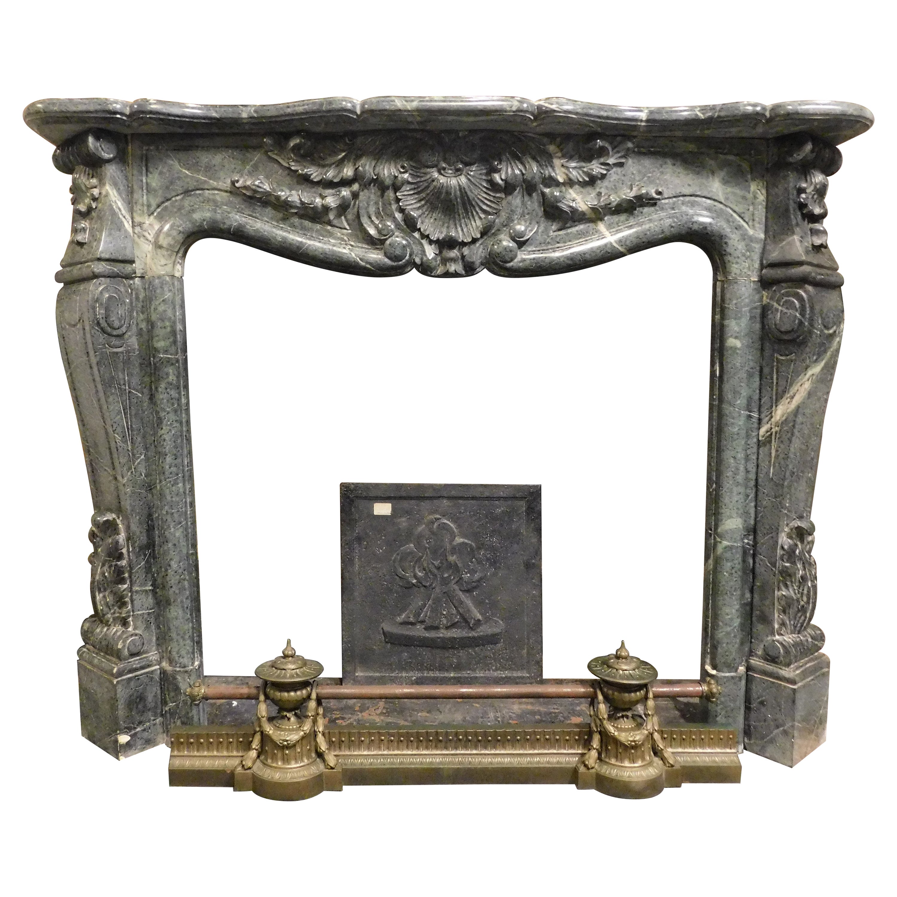 Vintage fireplace mantle in "Verde Alpi" marble, richly carved, Italy For Sale