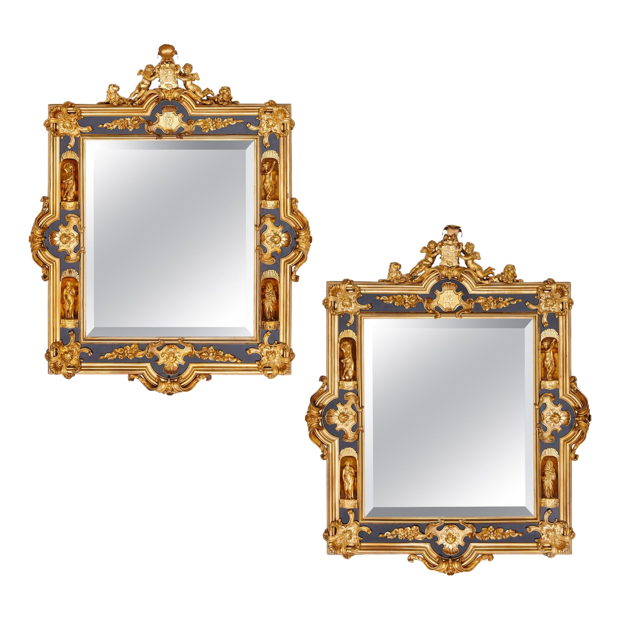 Paire de miroirs anglais en bronze doré et bois ébénisé en vente