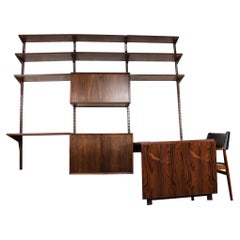 Danish modular shelf in Rosewood with integrated extendable desk, Poul Cadovius.