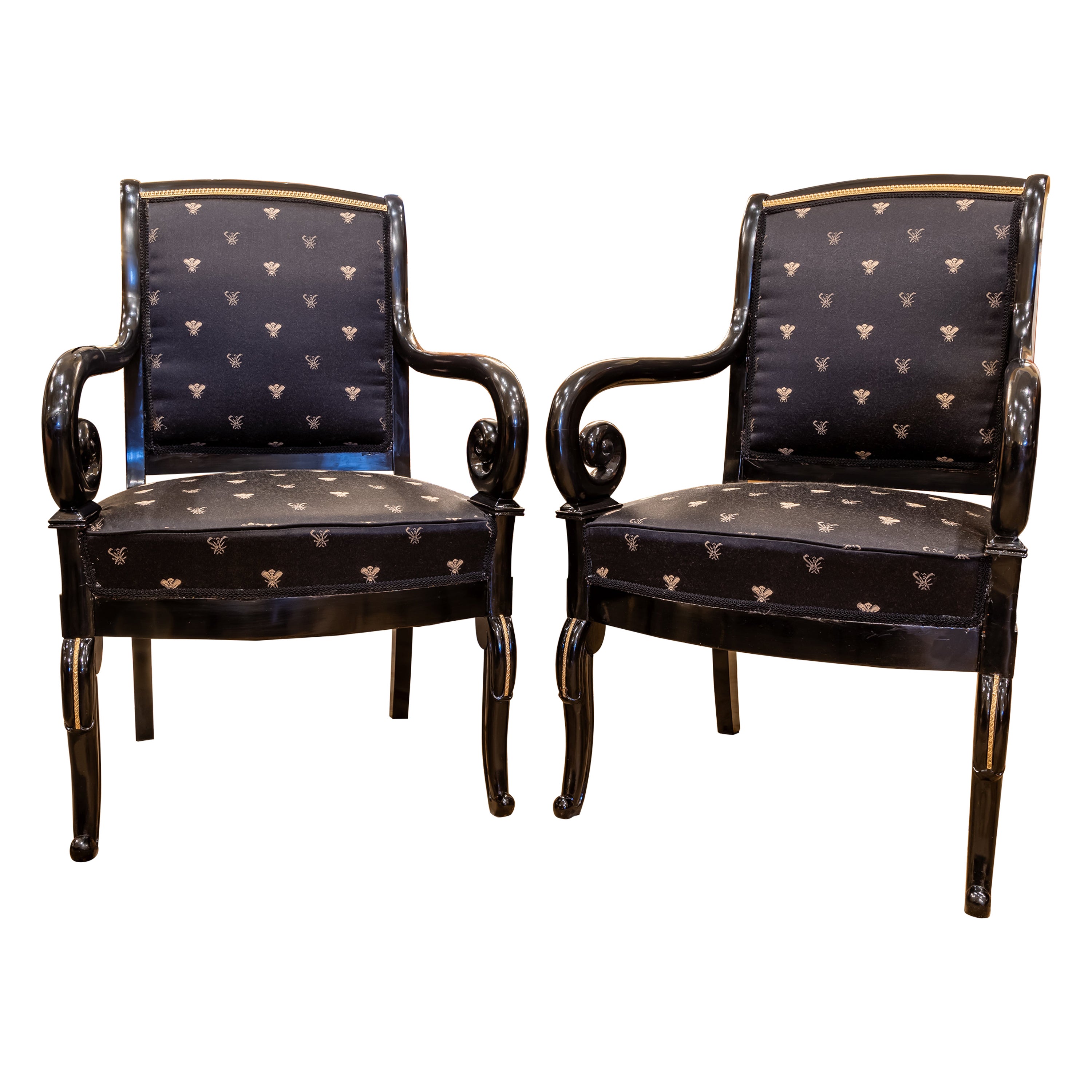 A fine pair of Charles X  ebonized and gilt bronze mounted fauteuils  For Sale