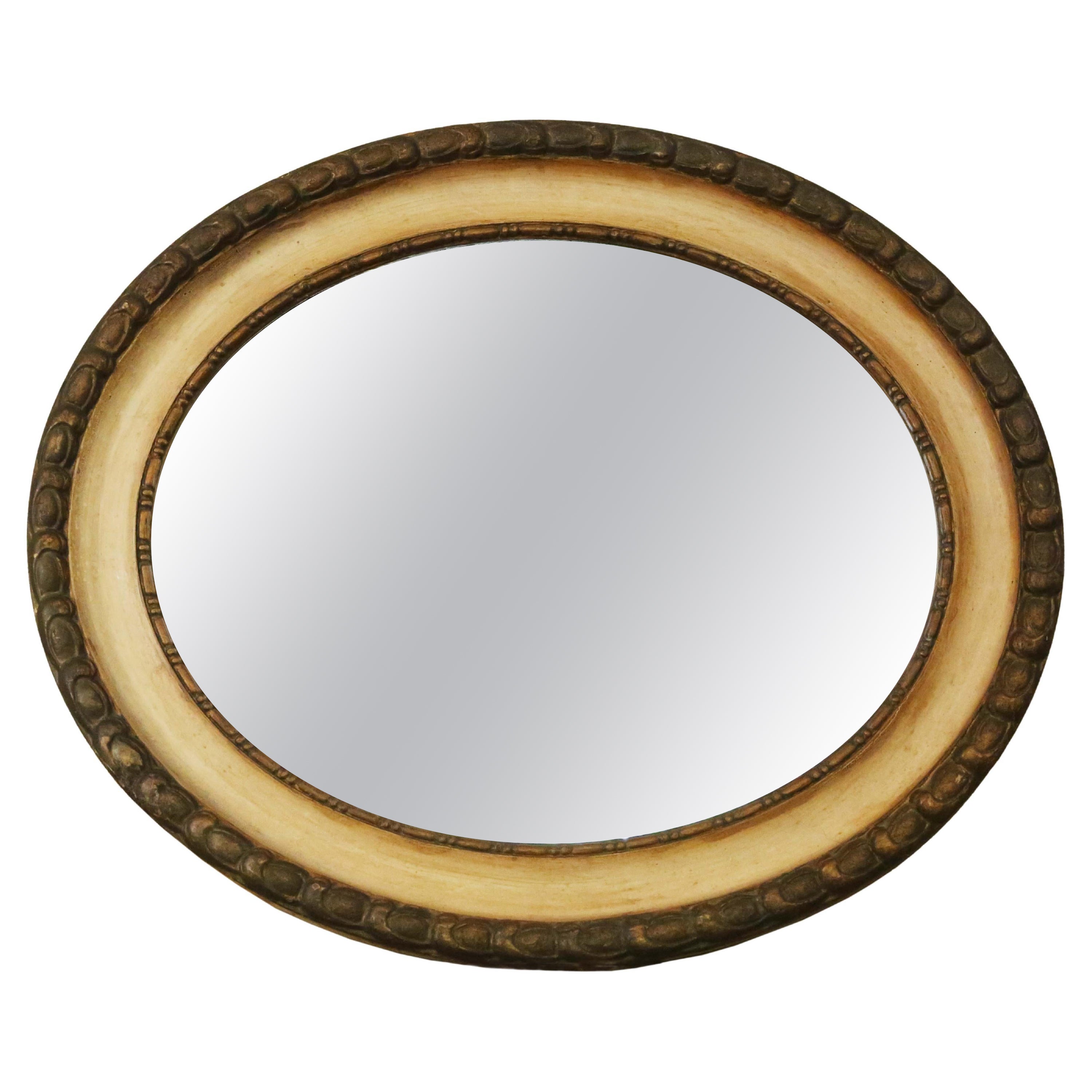 Antique quality oval gilt and cream overmantle wall mirror 19th Century For Sale