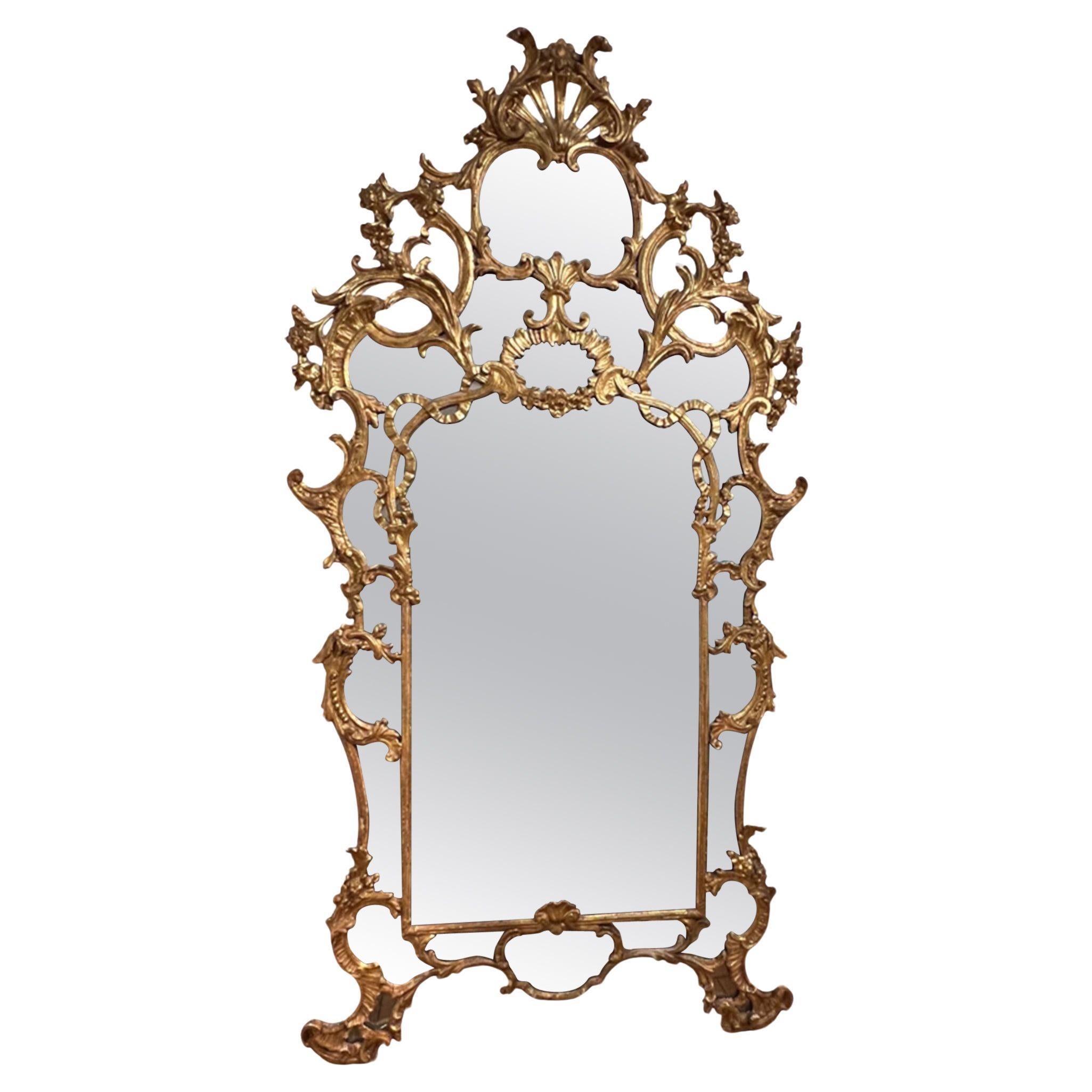 This is a stunning antique mirror - grand scale and highly decorative with beautiful wood  carved framing and the original plate glass. 

Please take a look at all our pictures to see the detail and incredible craftsmanship.

A gorgeous mirror of