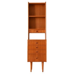 Slim teak bookcase with drawers