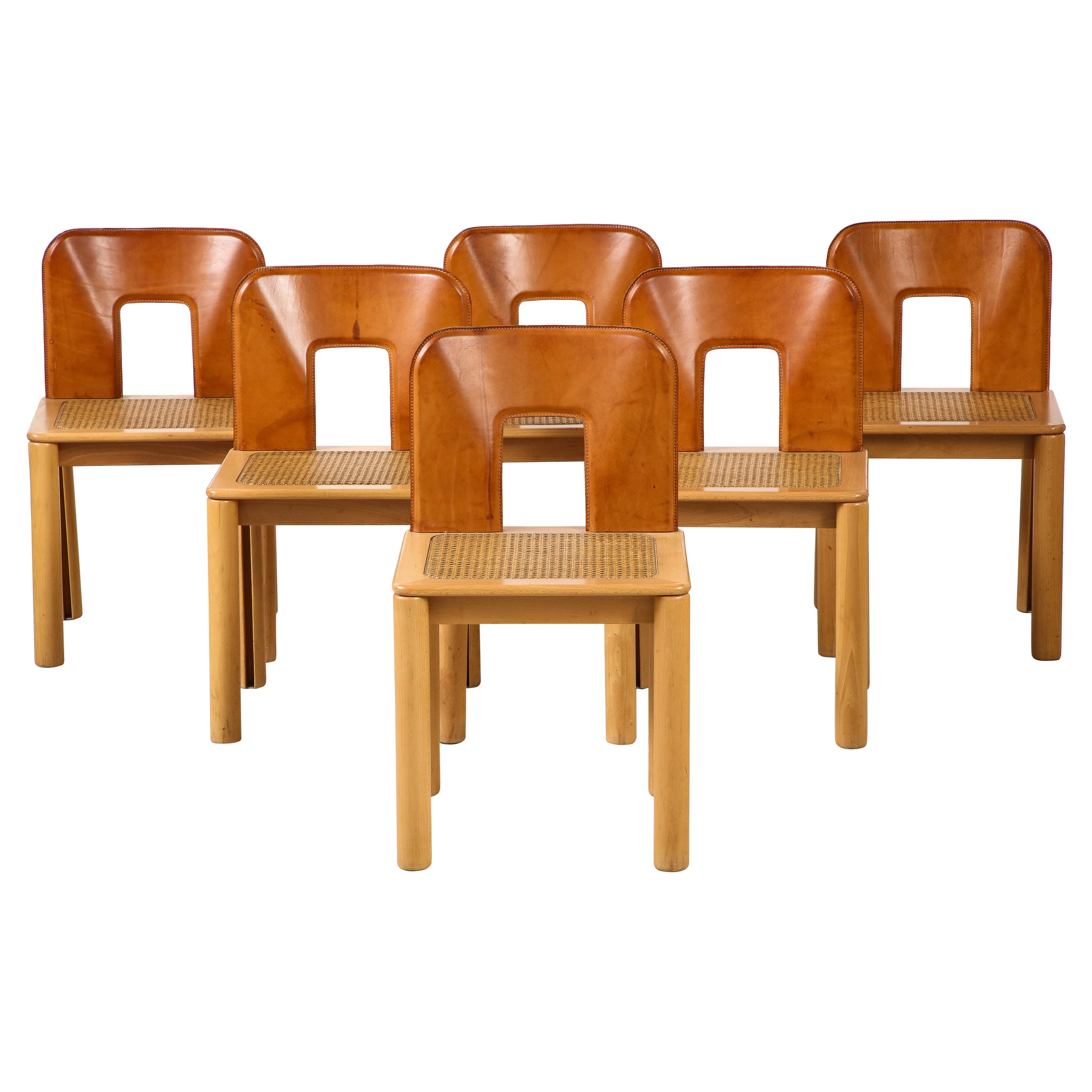 Italian 1970's Dining Chairs with Leather, Wood, Cane Seats, Italy, circa 1970 For Sale