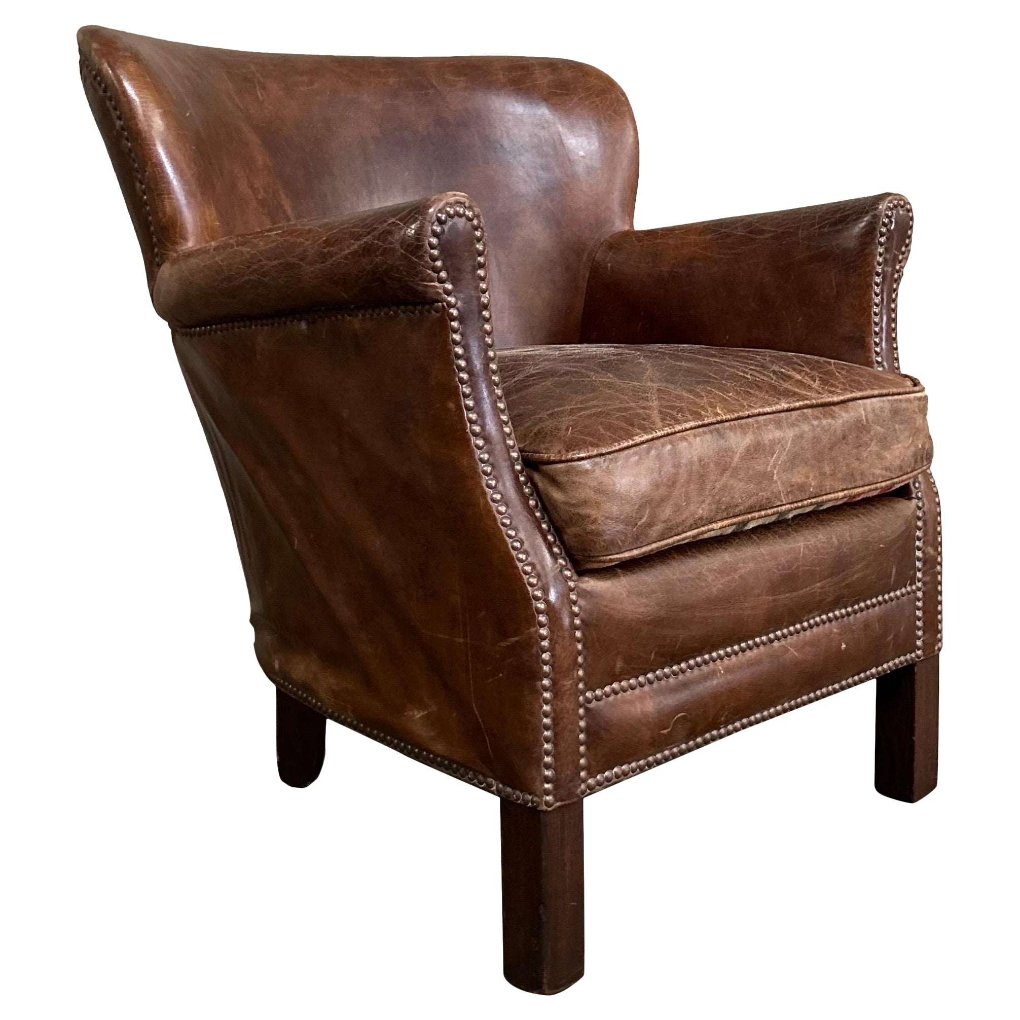 Vintage leather English wing chair For Sale