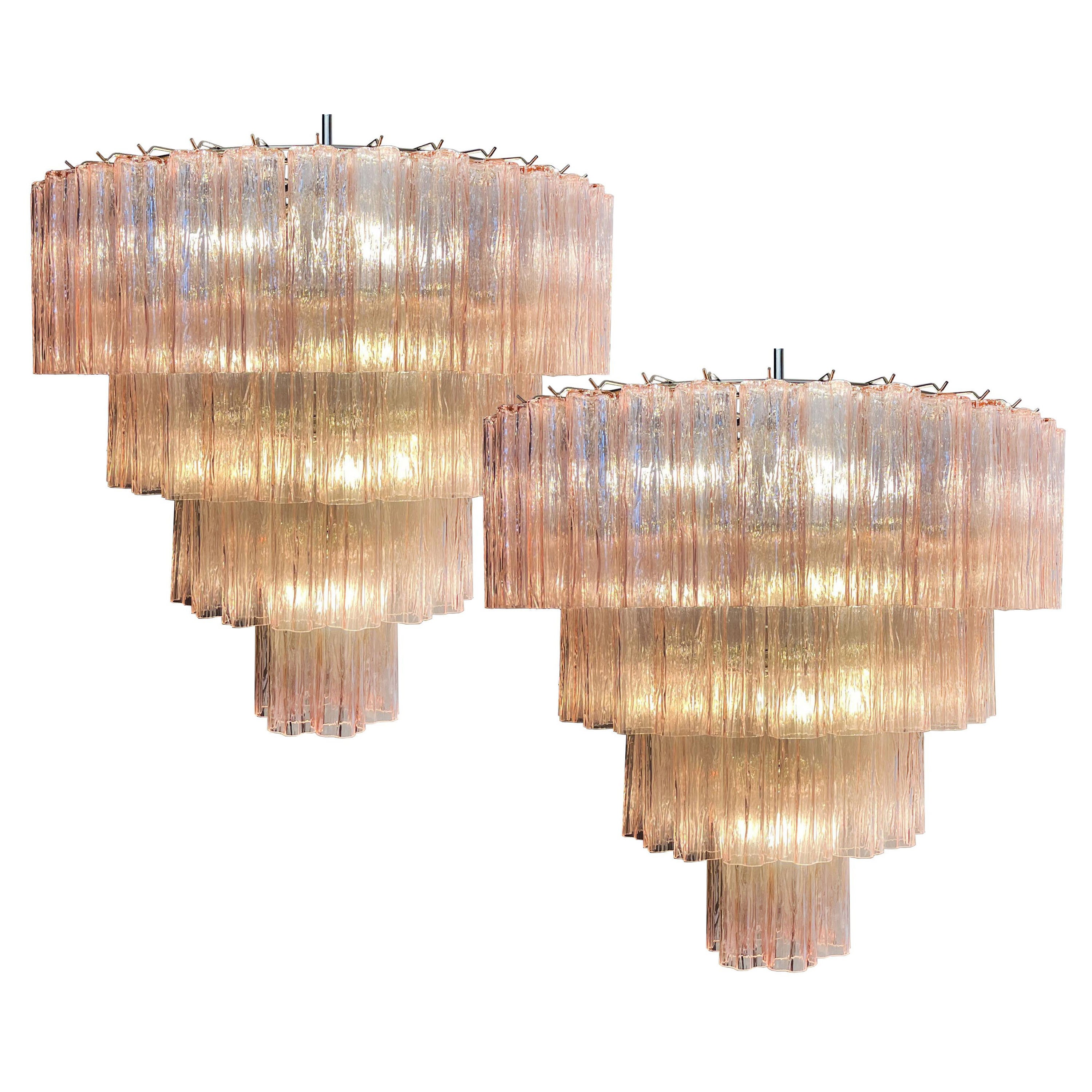 Italian chandelier in Murano glass and nickel-plated metal structure on 4 levels. The armor polished nickel supports 78 large pink glass tubes in a star shape.
Dimensions: 63 inches (160 cm) height with chain, 35.45 inches (90 cm) height without