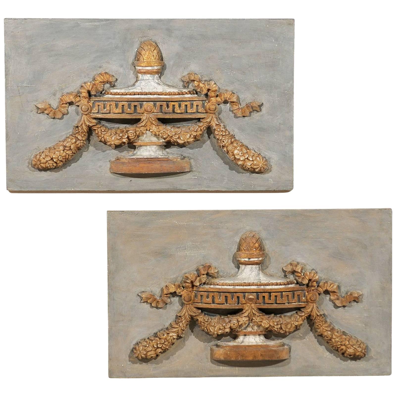 A Pair of Italian 19th C. Painted Wood Wall Plaques with Carved Urns For Sale