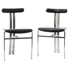 Sculptural dining chairs in black leather and chromed metal, Italian Space Age