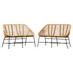 Pair of rattan and lacquered iron bench seats, France, circa 1950