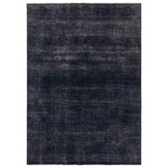 Alfombra persa vintage en azul y negro de Rug & Kilim