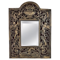 An Antique French Bronze and Wood Mirror