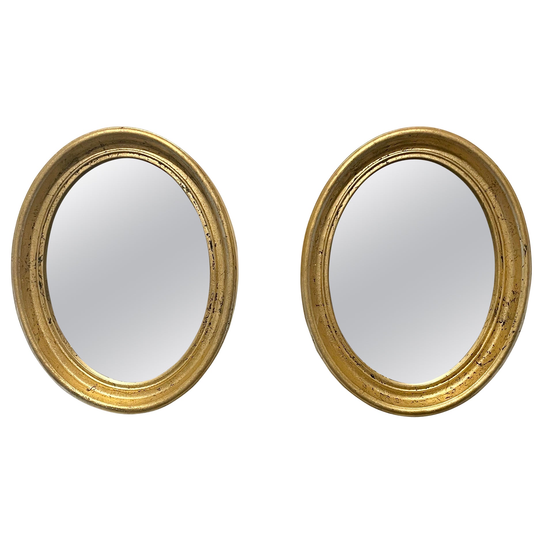 Pair Of Vintage Gilt Oval Italian Mirrors For Sale