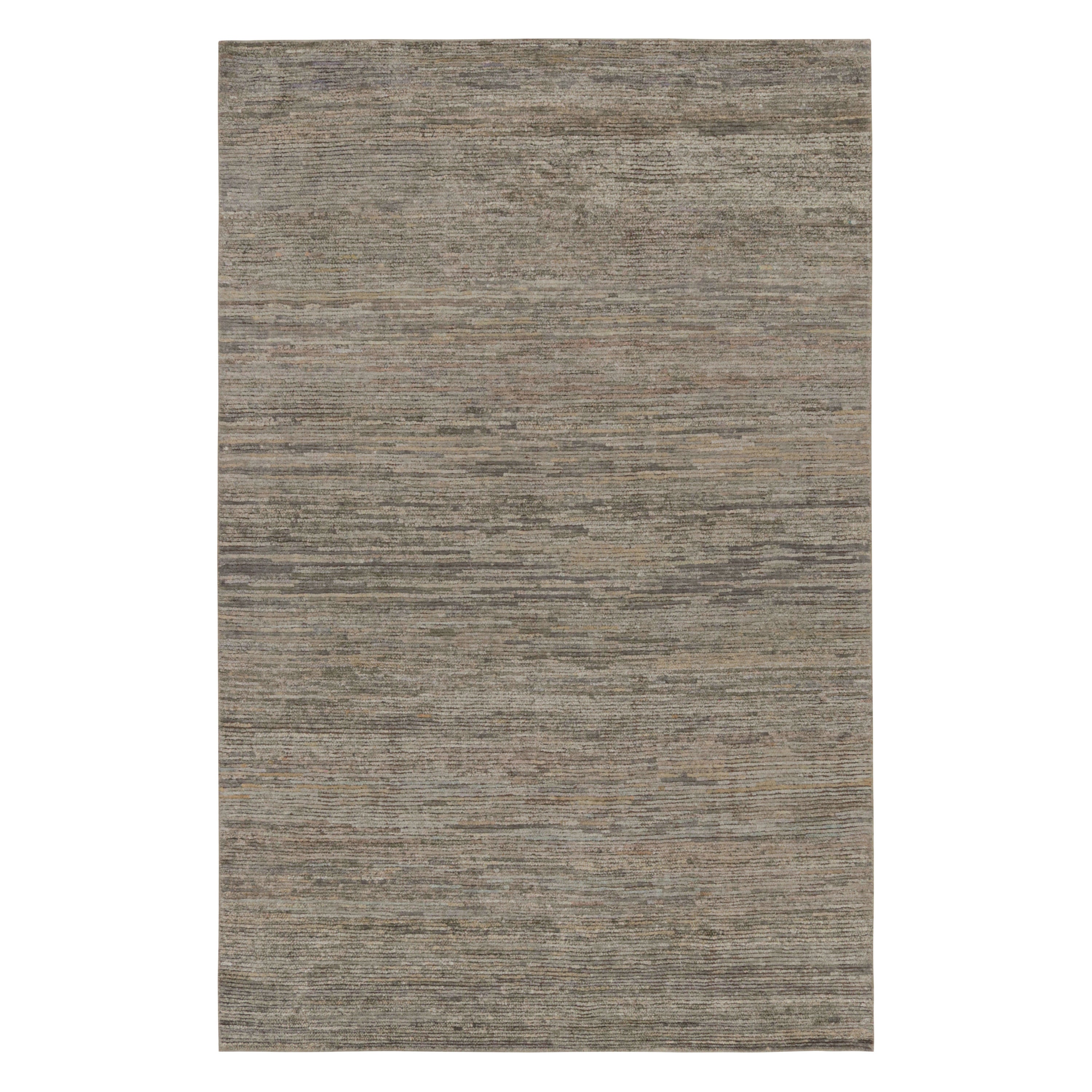 Hand-knotted in wool, silk and cotton, this 6x9 contemporary simple rug in gray and beige as an addition to the Rug & Kilim’s Texture of Color line of our Textural rug collection, is an inventive take on solid rugs with movement in its subtle