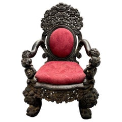 Chaise trône ancienne en bois sculpté du 19ème siècle 