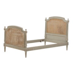 Vintage Painted French Louis XVI style cane youth or twin size bed.