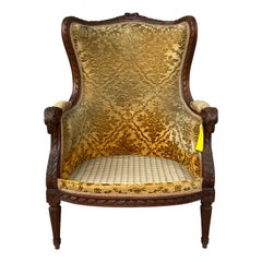 Chaise Bergère en noyer sculpté de style Louis XVI du XIXe siècle