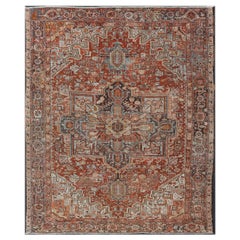 Antico Heriz persiano con medaglione geometrico in rosso e colori tenui 9'3 x 11'6