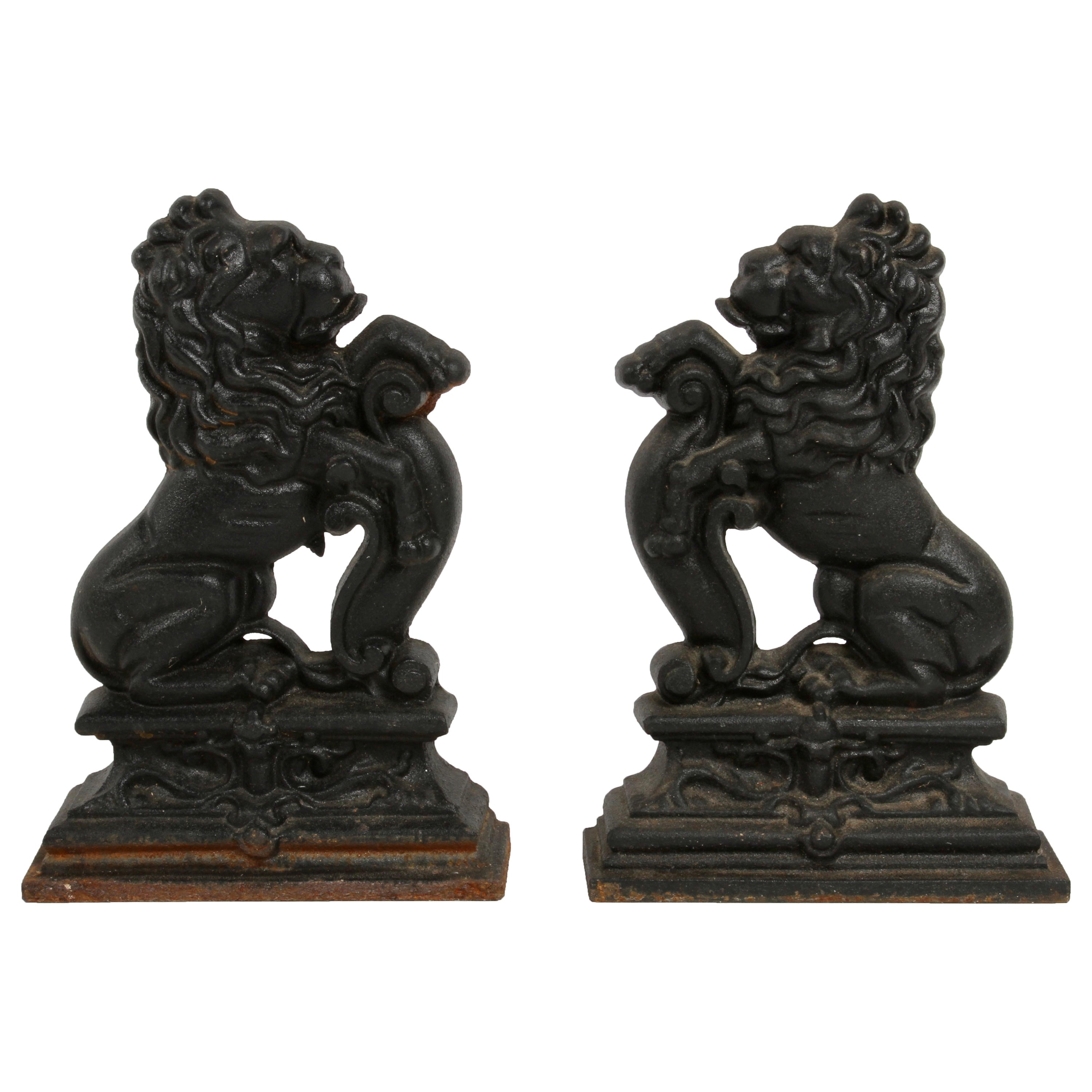 Pair of Cast Iron Andirons or Fire Dogs of Rampant Lions Resting on Shield