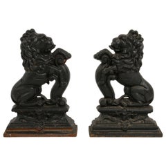 Retro Pair of Cast Iron Andirons or Fire Dogs of Rampant Lions Resting on Shield