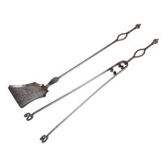  Set of wrought iron fire tools, shovel and tongs.