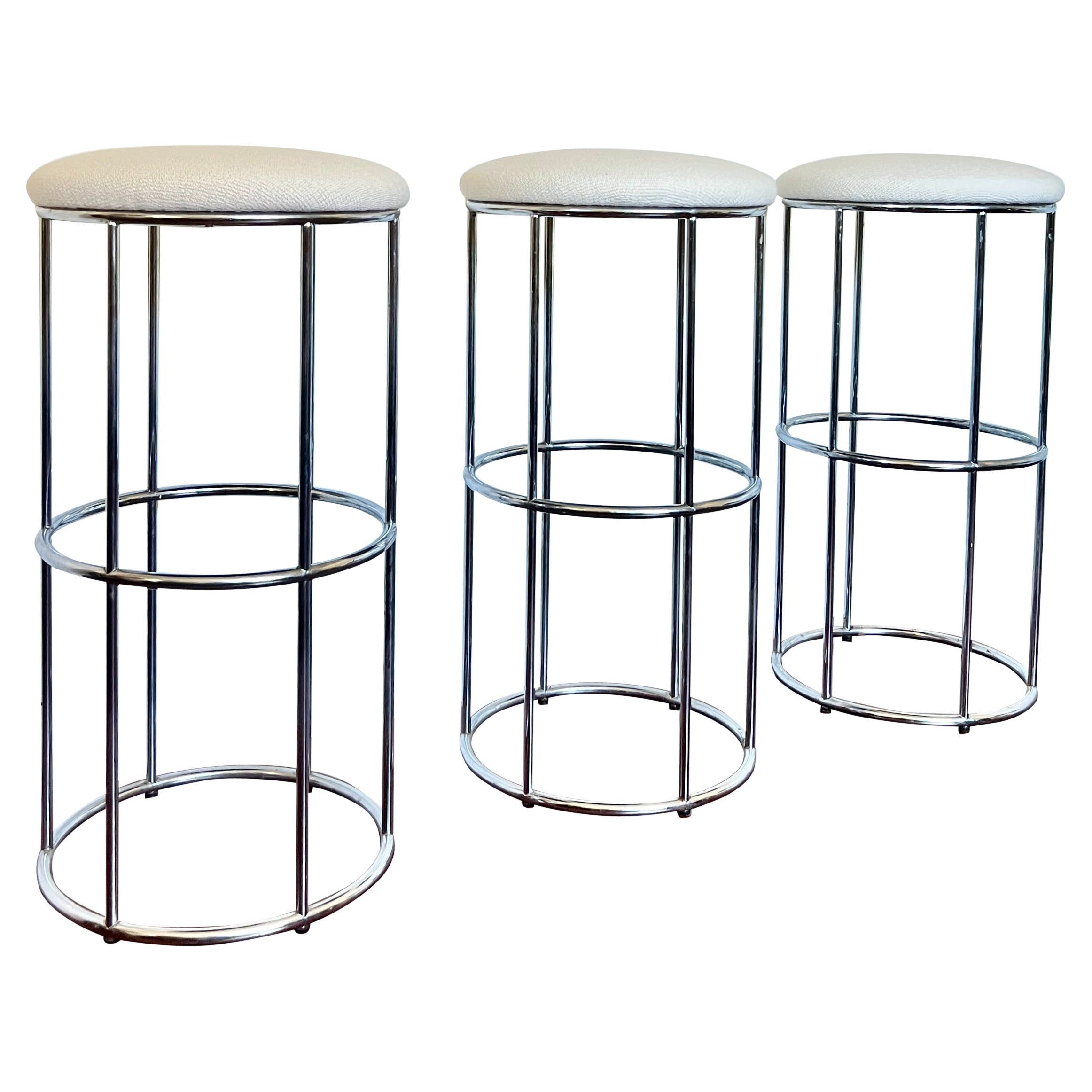 Vintage set of 3 chrome barstools newly reupholstered in an ivory boucle fabric For Sale