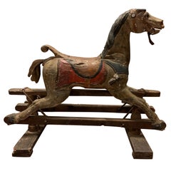 Jouet de cheval à bascule antique en bois polychrome, Italie