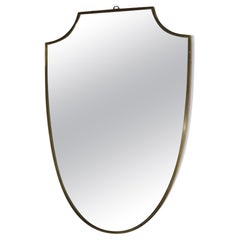 Brass shield shape italian mirror
