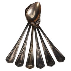 WMF. Juego de seis cucharas de postre Art Nouveau bañadas en plata, sin usar.