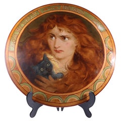 An Art Deco hand painted plate depicting Lois the Witch holding a black cat.