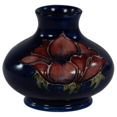 William Moorcroft. A small Anemone blue vase signed H M Made in England.