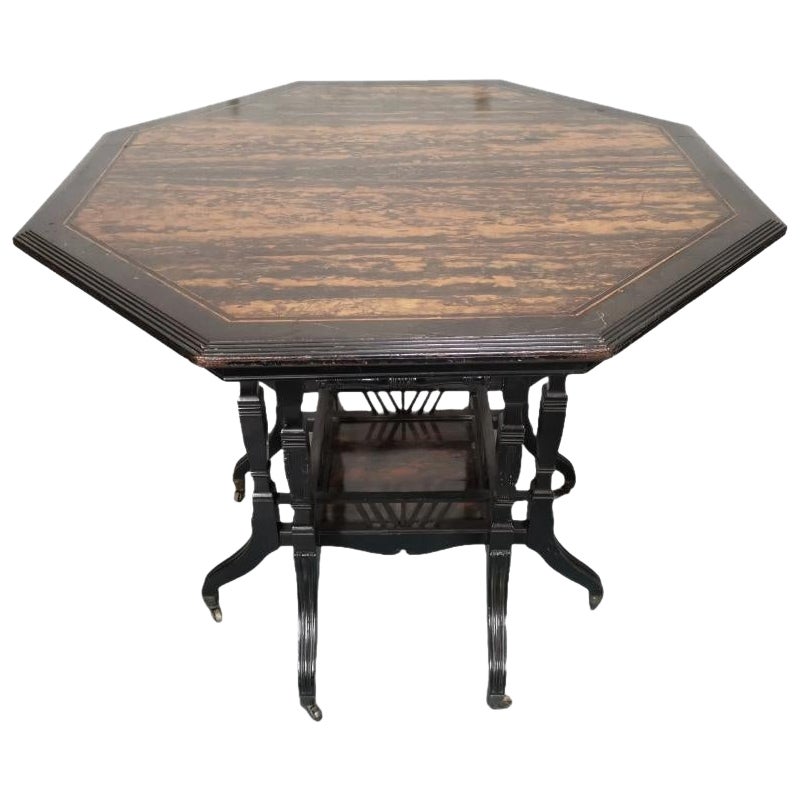 Lambs of Manchester An Aesthetic Movement ebonized Walnut eight leg centre table For Sale