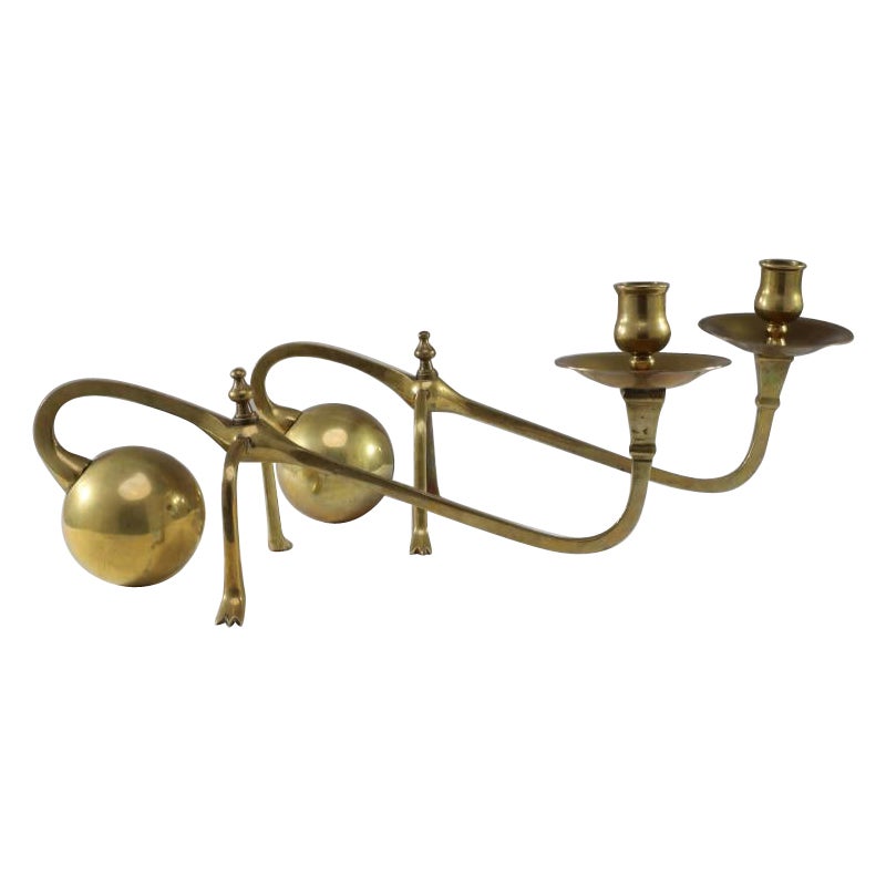 WAS Benson (style of). A Pair of Brass Arts & Crafts Piano Candle Holders