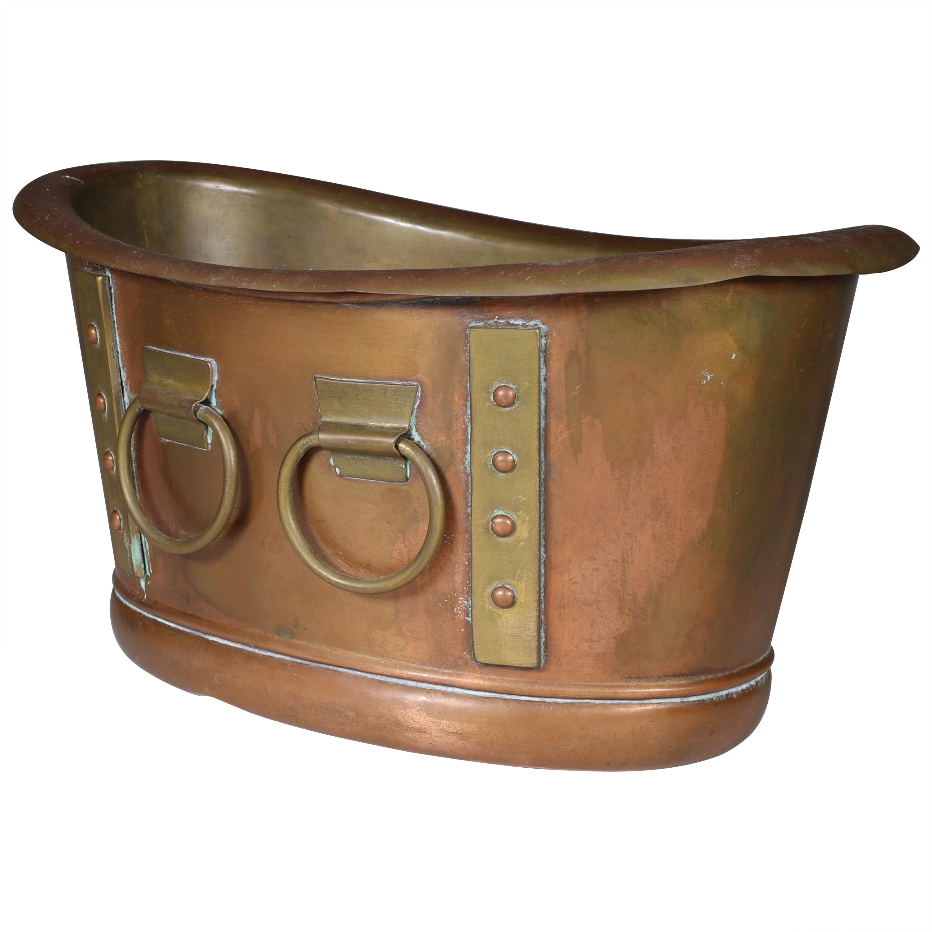 Liberty and Co. A brass Arts and Crafts boat shaped champagne bucket. For Sale