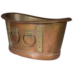 Antique Liberty and Co. A brass Arts and Crafts boat shaped champagne bucket.