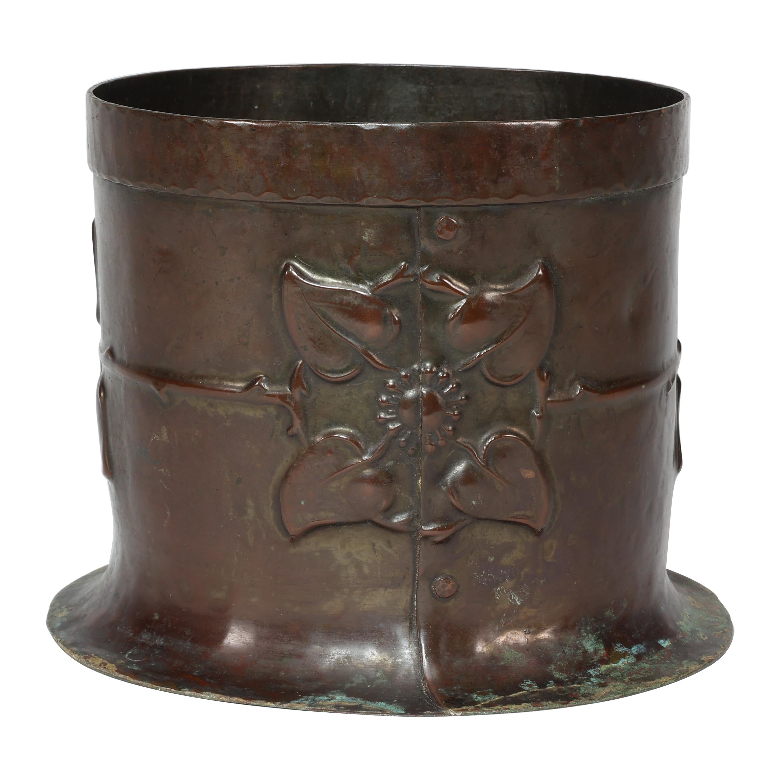 Guild of Handicraft style of. An Arts & Crafts copper plant pot with two florets For Sale
