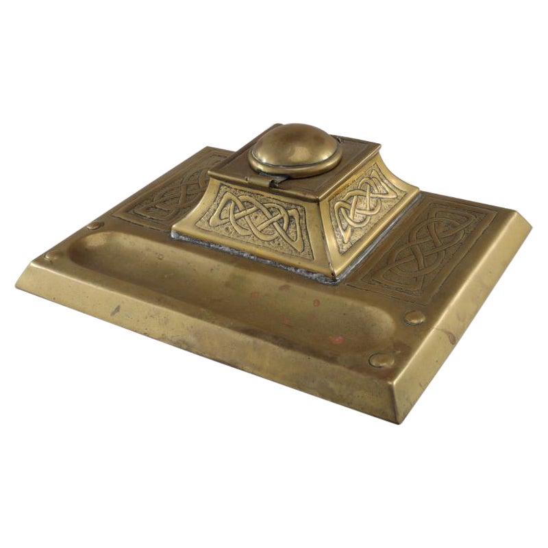Margaret Gilmour School. An Arts & Crafts brass inkwell with Celtic interlacing.