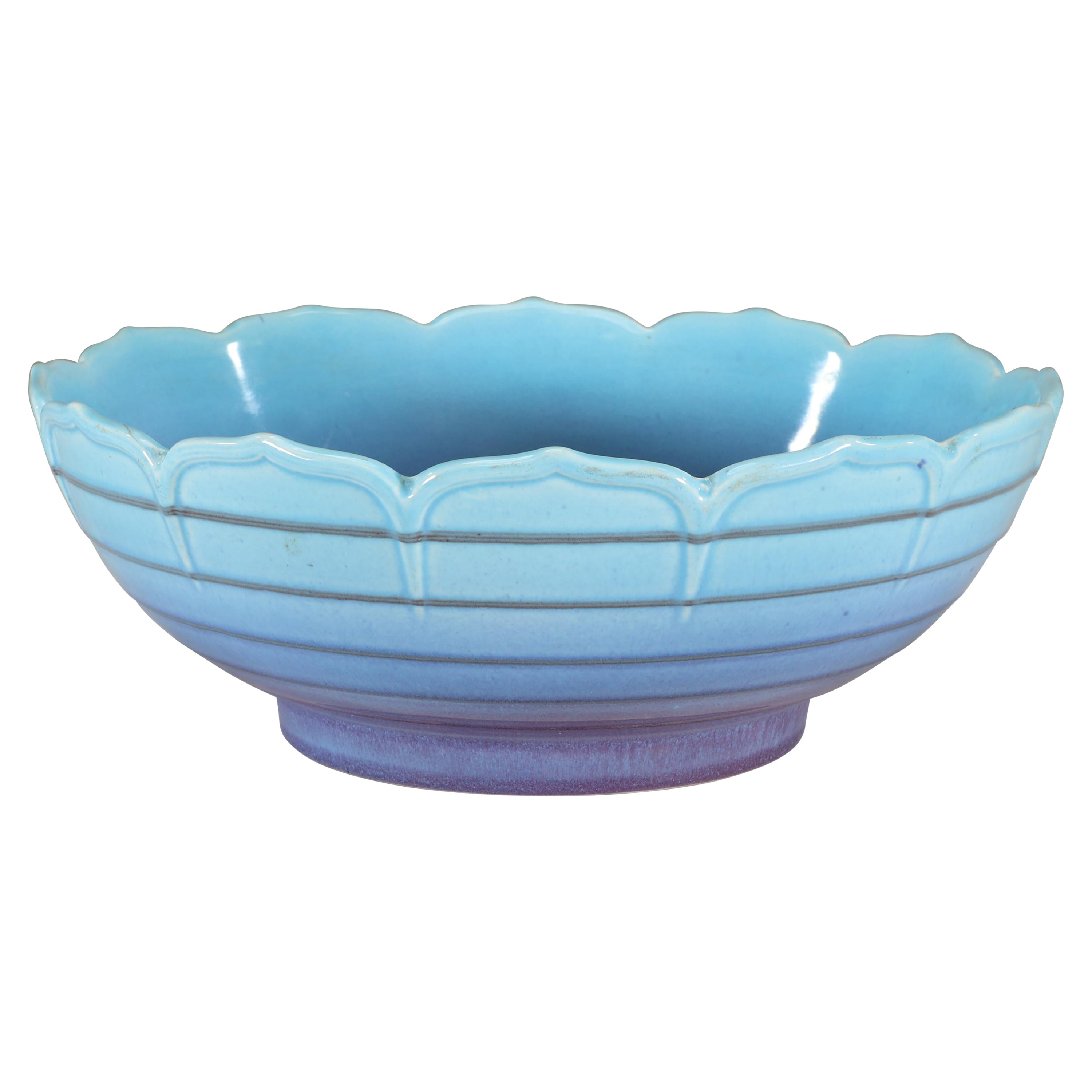 Crown Ducal. Arts & Crafts style bowl with a ground blue colour fading to lilac.