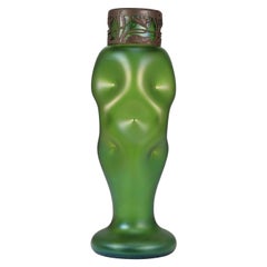 Loetz attr. A tall Art Nouveau green iridescent vase with brass floral collar.