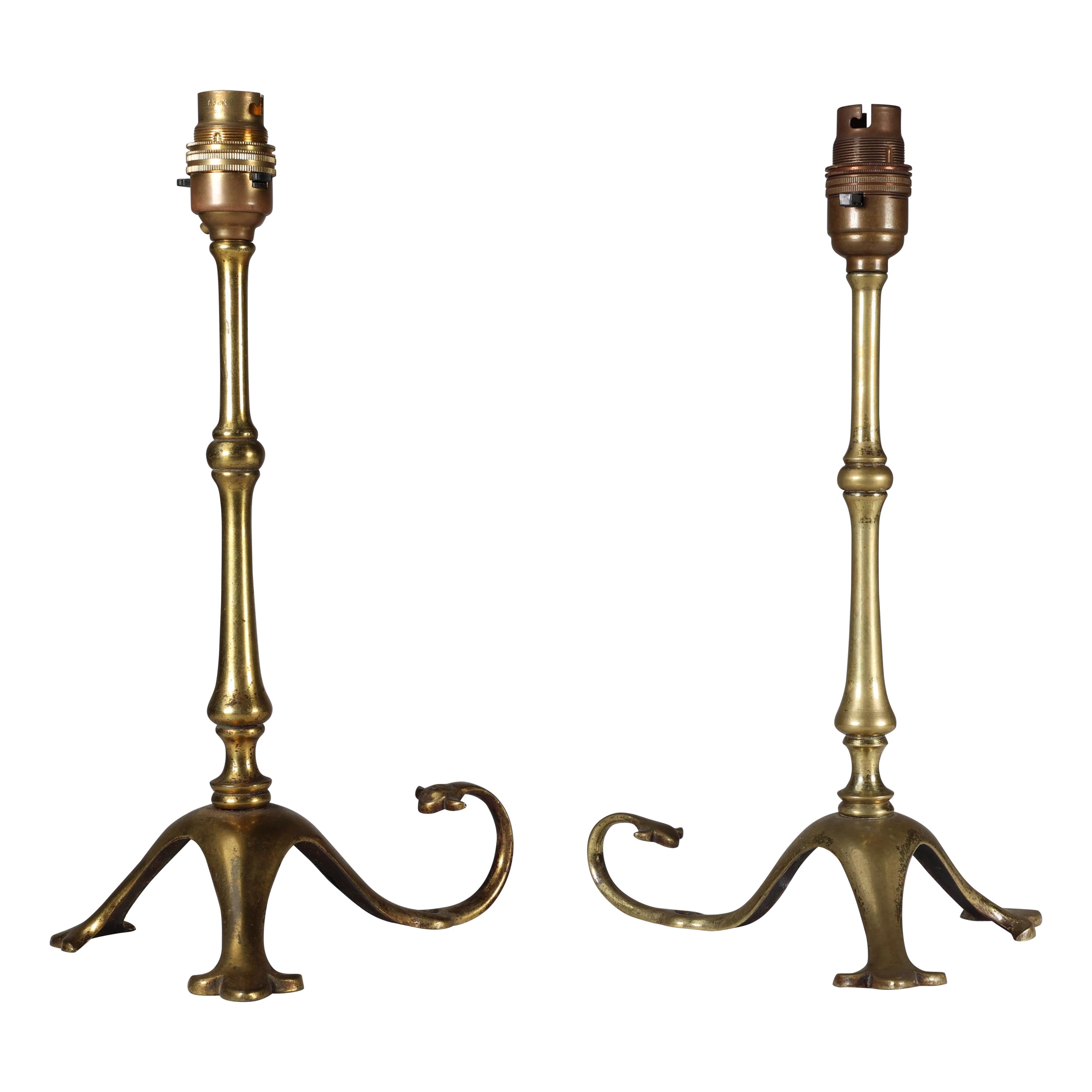 WAS Benson. A pair of Arts & Crafts brass table lamps with a serpent style tails