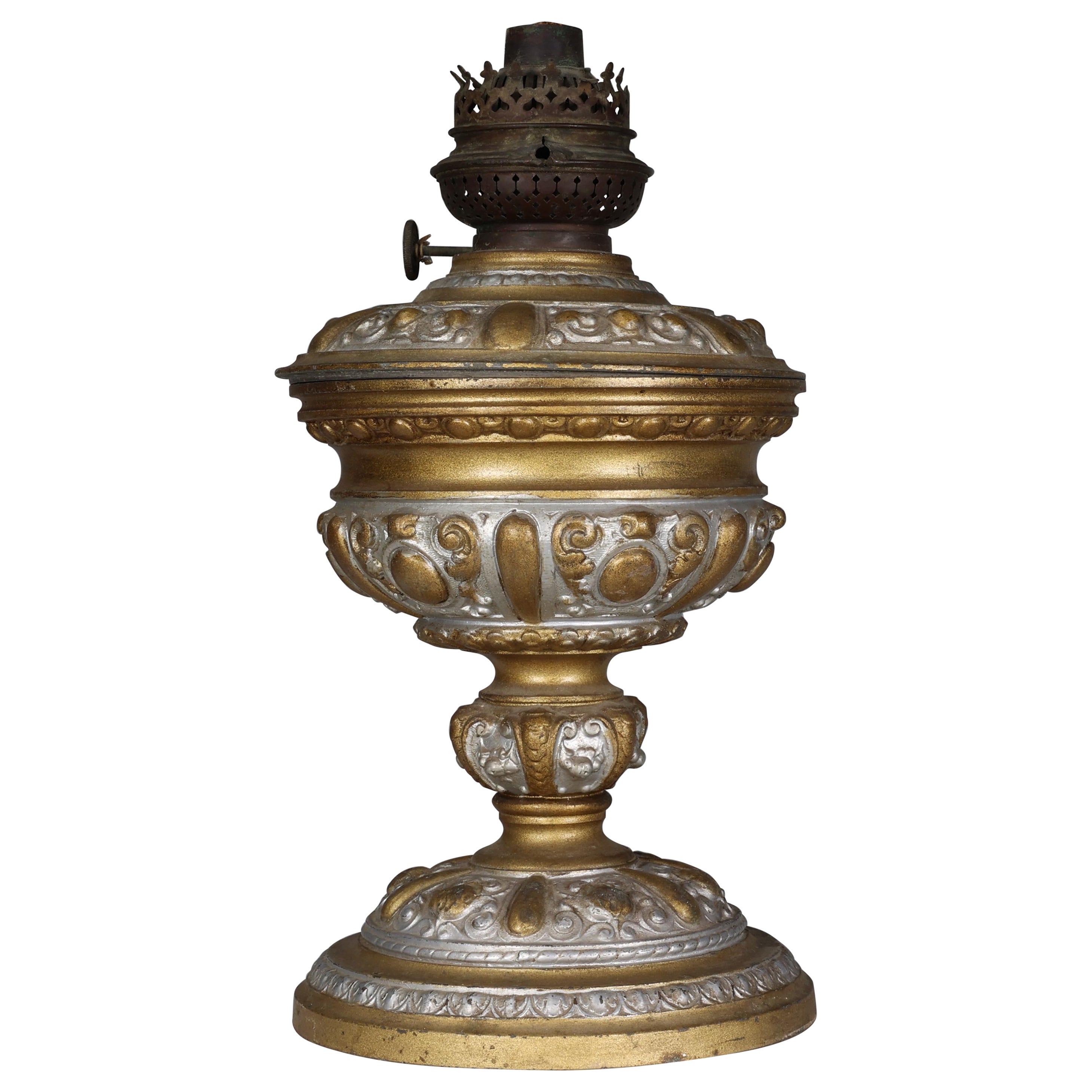 An original French Rococo style cast alloy and over painted oil lamp For Sale