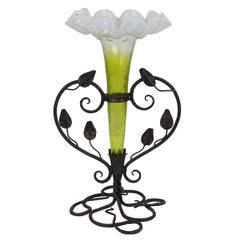Antique Art Nouveau French hand made iron epergne with a green & Vaseline glass flower.