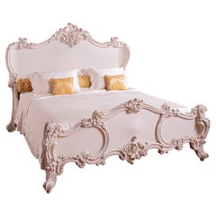A French Rococo Style 'Cherub' Bed Painted In White Gesso By La Maison London